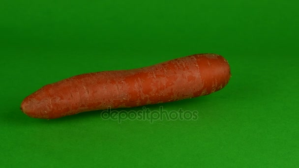 Carrot rotates on green background. Chroma key background - Footage, Video