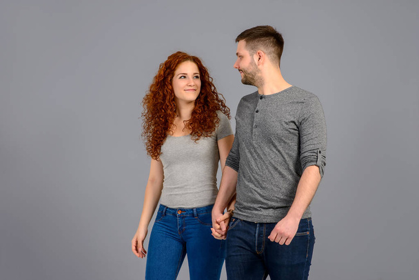 Nice young couple in the studio	 - Foto, afbeelding