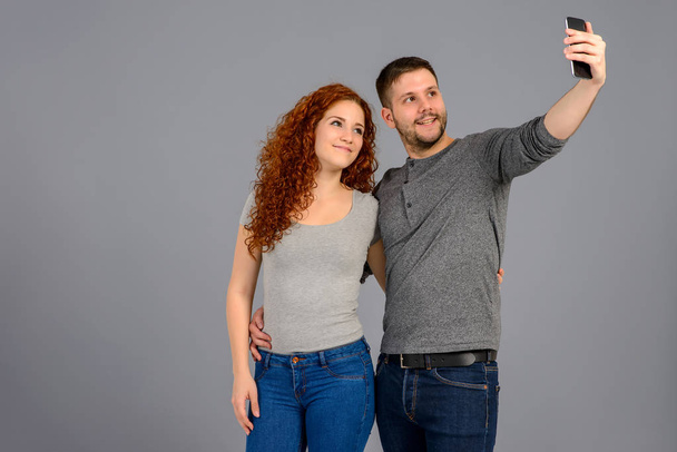 Nice young couple in the studio - Photo, image