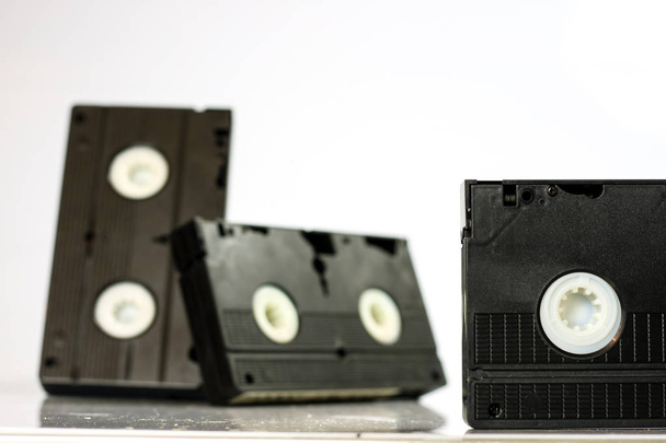 Old good video cassettes. Dusty family recordings on solid data  - Foto, afbeelding