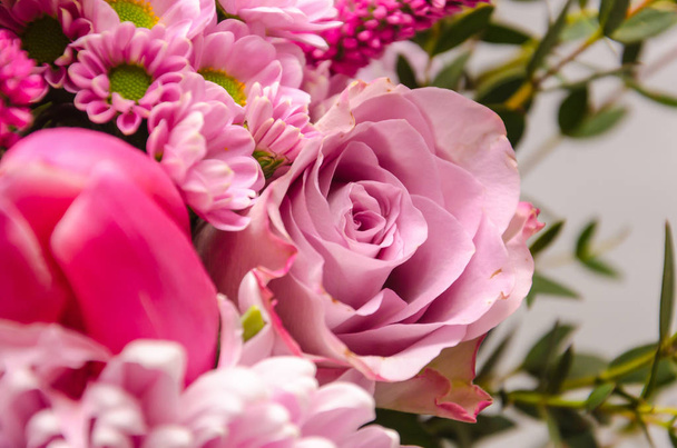 Delicate fresh bouquet of fresh flowers with a pink rose.  - Photo, Image