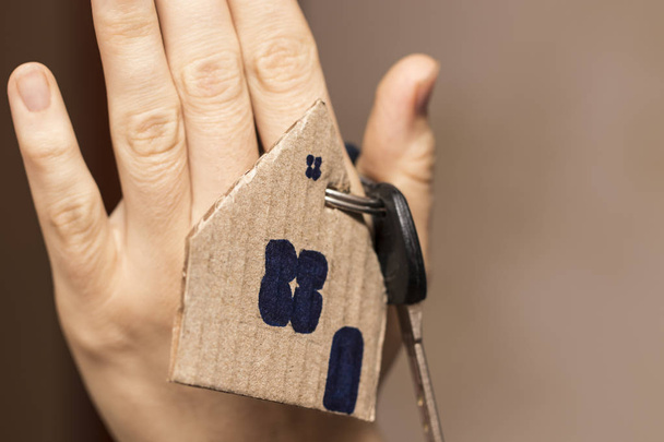 Female hand holding house key,real estate agent - Photo, Image