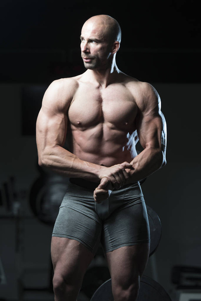 Bodybuilder Posing Biceps After Exercises - Photo, Image