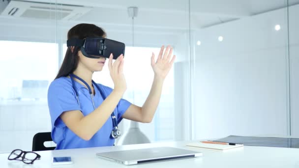 Doctor Using virtual reality glasses in Clinic, Vr Goggles - Materiał filmowy, wideo