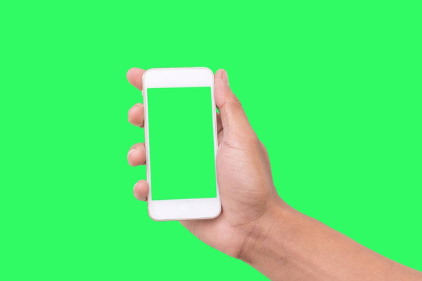 Mano muestra smartphone móvil con pantalla verde en posición vertical aislado sobre fondo verde
 - Foto, Imagen