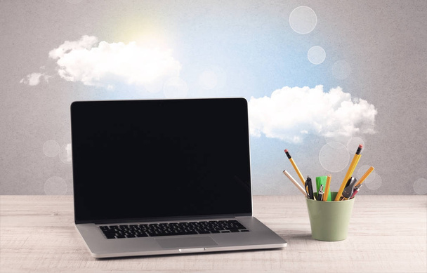 Bright sky with clouds and office desk - Foto, afbeelding