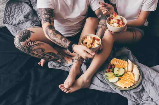 couple having healthy breakfast in bed - Photo, Image