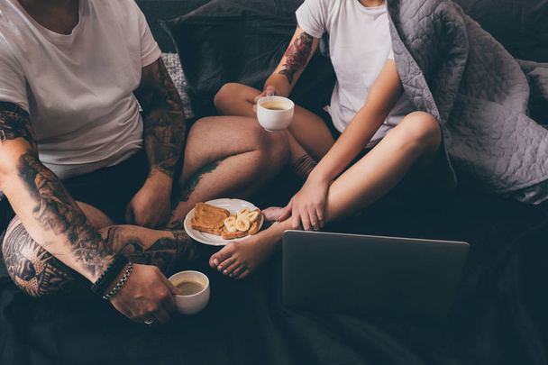 couple drinking coffee in bed in morning - Photo, Image