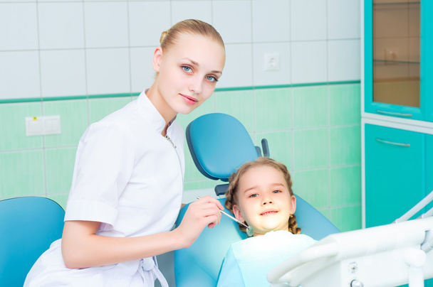 Young doctor woman and girl in dentist office - Fotografie, Obrázek
