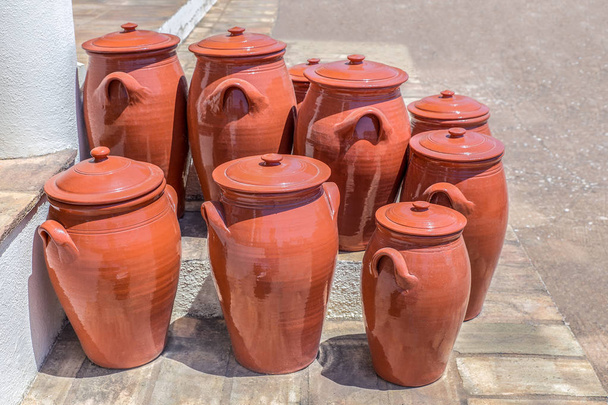 Several clay pots on floor outside pottery - Photo, Image