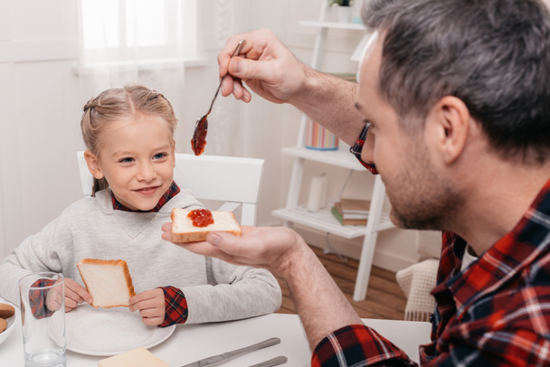 father and daughter having breakfast - Photo, Image