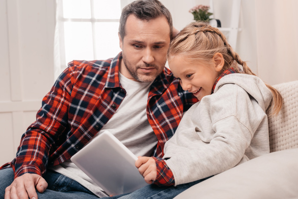 father and daughter with digital tablet - Photo, image