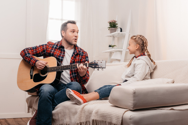 father and daughter playing guitar - Foto, Bild