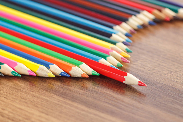 Набір кольорових олівців, дерев'яний фон
 - Фото, зображення