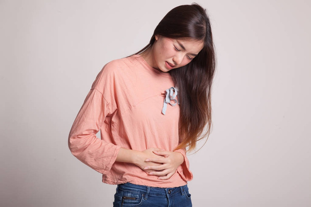 Young Asian woman got stomachache. - 写真・画像