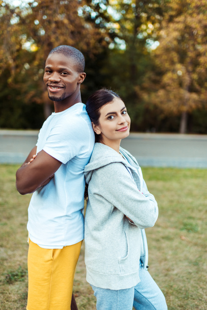 Multicultural couple standing in sportswear  - Photo, Image