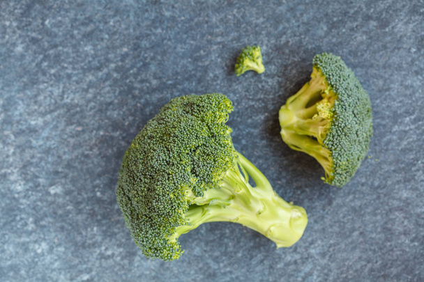 Sliced green raw broccoli, a healthy ingredient for vegan food.  - Fotografie, Obrázek