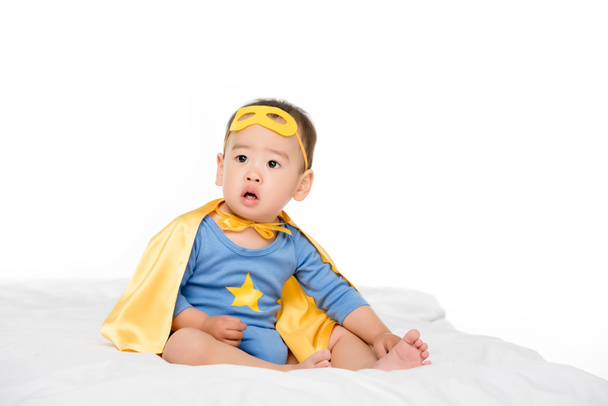 asian toddler in superhero cape - Фото, изображение
