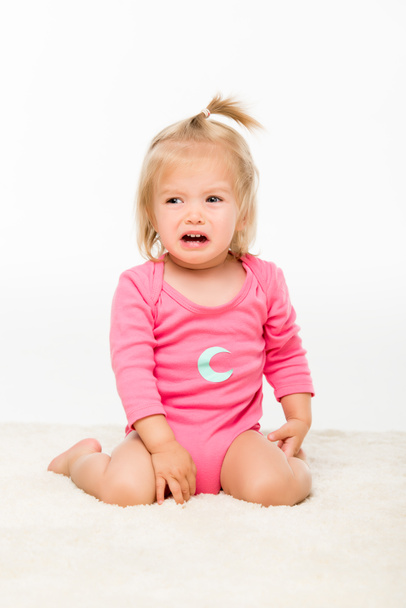 crying toddler in bodysuit - Valokuva, kuva