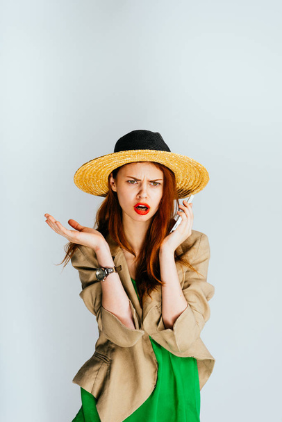 sorry girl in a hat talking on the phone - Foto, Imagen