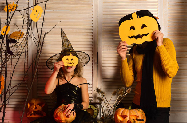 Halloween party concept. Wizard and little witch in hat - Photo, Image