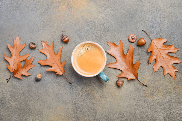 Autumn Composition with Cup of Coffee and Autumn Leaves on Stone or Concrete Background - Foto, Imagen