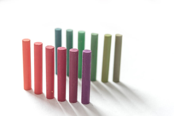 Close up of bunch standing colorful pastel chalks with color gra - Photo, image