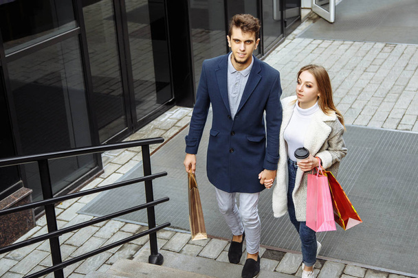 Portrait of a couple with shopping bags. - Fotografie, Obrázek