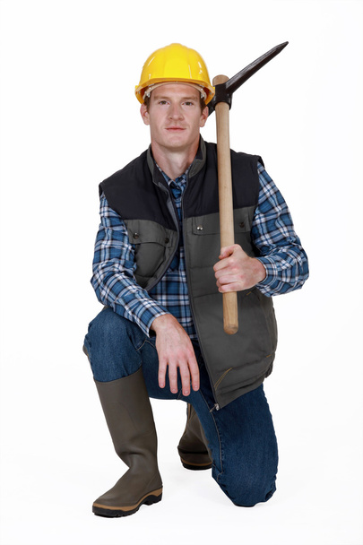 Man holding pickaxe - Фото, зображення