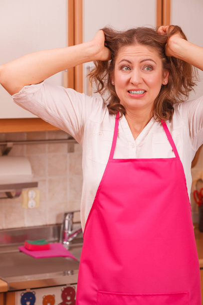 Unhappy housewife in kitchen - Foto, Imagem