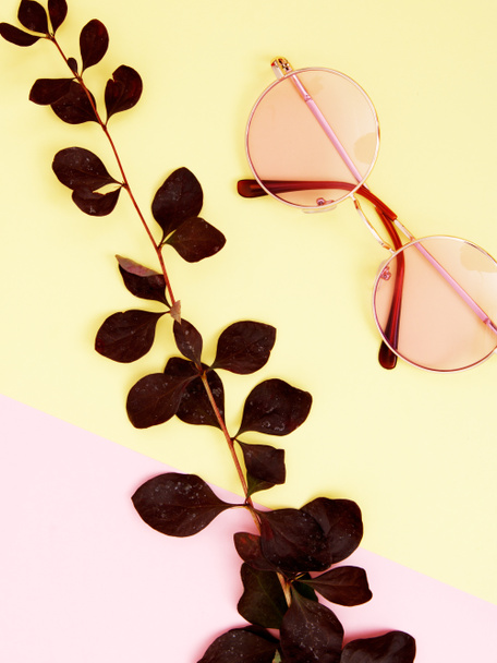 Minimal style. Minimalist Fashion photography. Fashion sunglasses. Summer is coming concept. Pink glasses on a pastel background, top view. Trendy minimal style with colorful paper backdrop - Φωτογραφία, εικόνα