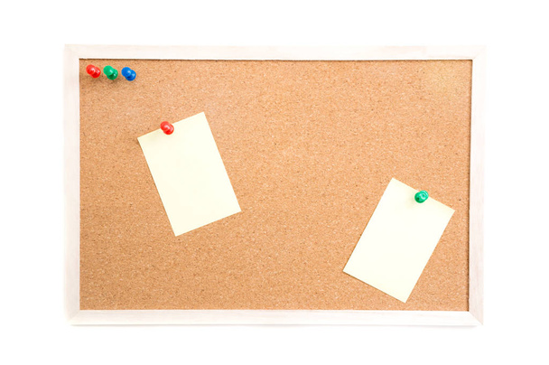 Cork board with post it and push pins and wooden frame on white background with clipping path - 写真・画像