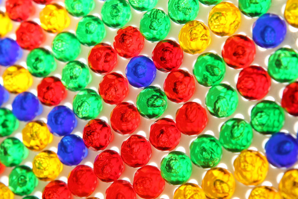 Side view of colorful plastic pins on the white desk - Photo, Image