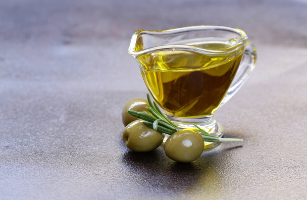 vegetable oil from olives in a glass sauce vessel - Fotó, kép