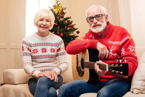 senior couple with acoustic guitar  - Photo, Image