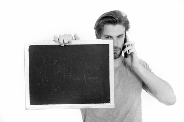 man with smartphone and blackboard - Foto, Imagem