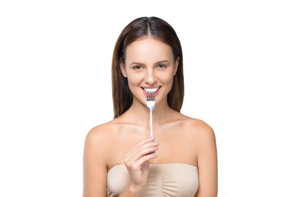 young woman with fork - Фото, изображение