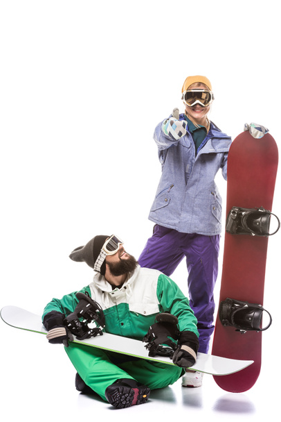 pareja en trajes de snowboard con tablas de snowboard
 - Foto, Imagen