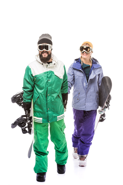 pareja en trajes de snowboard con tablas de snowboard
 - Foto, imagen