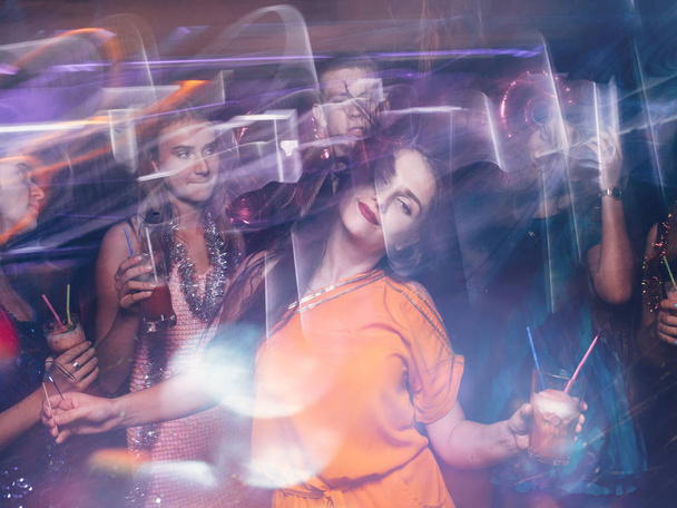 Disco party in night club in blurred motion - Фото, зображення