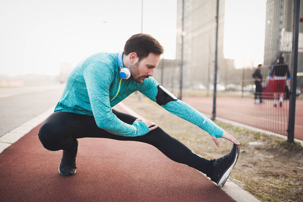 man stretching before exercising - 写真・画像