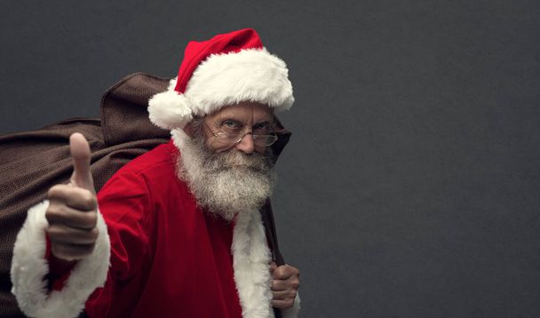 Santa Claus giving thumbs up - Фото, зображення