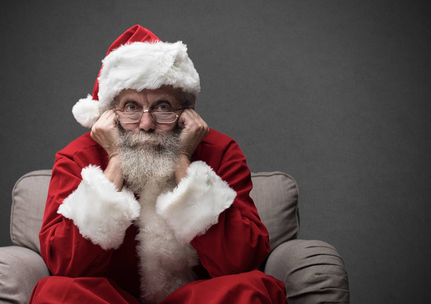 Santa Claus sitting on armchair - 写真・画像