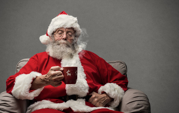 Santa Claus relaxing at home - Photo, Image