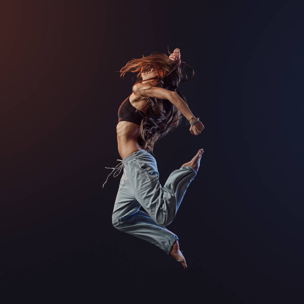 Young dancer performing and jumping - Photo, image