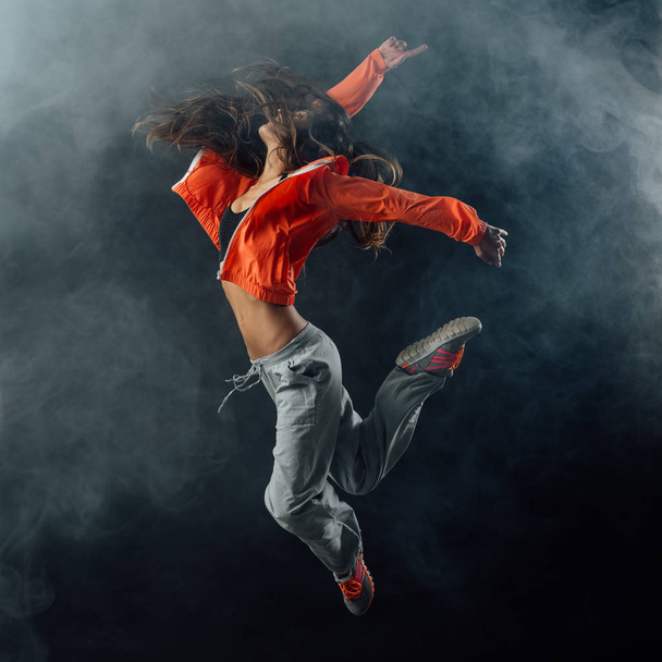 Young dancer jumping and performing - Fotó, kép