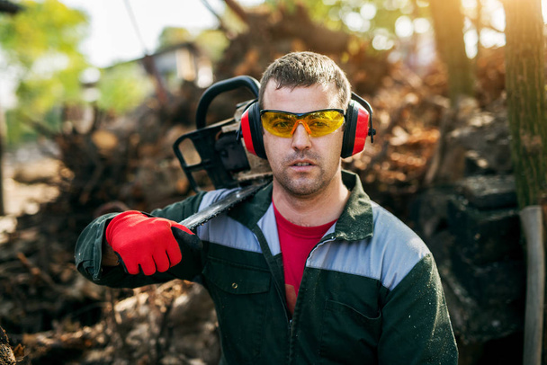 professional lumberjack with chainsaw  - Photo, Image