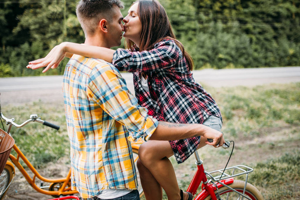 love couple kissing on vintage bicycle - Photo, Image