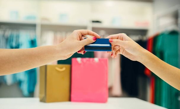 Woman in shop with credit card  - Фото, зображення
