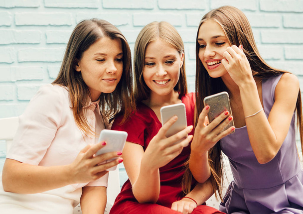 Women using modern phones - Fotó, kép